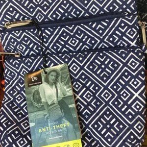 Travelon Anti-Theft Crossbody blue and white tile with theft proof zipper locks